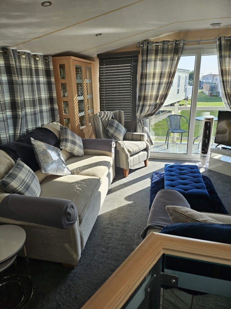 The Grange Haven lounge with seating and patio doors